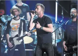  ??  ?? Dierks Bentley performs “Woman, Amen” at the 53rd annual Academy of Country Music Awards on Sunday.