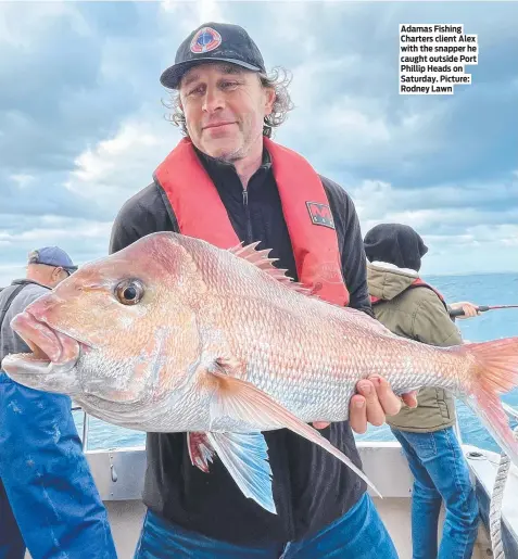  ?? ?? Adamas Fishing Charters client Alex with the snapper he caught outside Port Phillip Heads on Saturday. Picture: Rodney Lawn