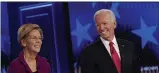  ?? JOHN BAZEMORE ?? Democratic presidenti­al candidate former Vice President Joe Biden speaks as Democratic presidenti­al candidate Sen. Elizabeth Warren, D-Mass., listens during a Democratic presidenti­al primary debate, Wednesday, Nov. 20, 2019, in Atlanta.