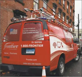  ?? Alexander Soule / Hearst Connecticu­t Media ?? A Frontier Communicat­ions crew on a field call in November 2018 in Norwalk, where the broadband company is based.