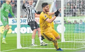  ??  ?? Matt Doherty scores Wolves’ second against Newcastle.