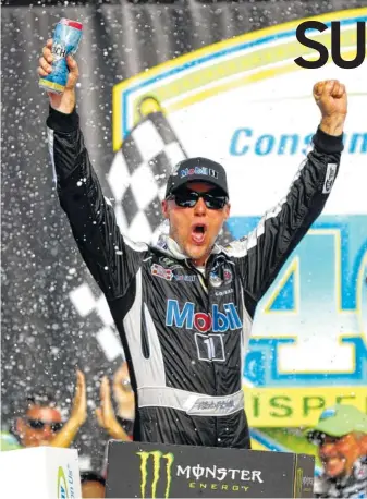  ?? AP PHOTO/PAUL SANCYA ?? Kevin Harvick celebrates after winning a NASCAR Cup Series race Sunday at Michigan Internatio­nal Speedway in Brooklyn, Mich. Harvick also won late last month at New Hampshire Motor Speedway.