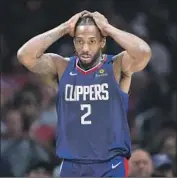  ?? Allen J. Schaben Los Angeles Times ?? CLIPPERS FORWARD Kawhi Leonard on the team: “We’ve got a long way to go. We’re going to get there.”