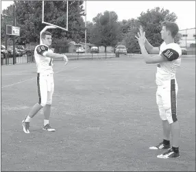  ?? MARK HUMPHREY ENTERPRISE-LEADER ?? Farmington junior Jacob Gray (right), shown catching a pass from Cardinal quarterbac­k Trey Waggle, was voted Outstandin­g Tight End from the 5A West for the 2016 season, although the Cardinals went only 2-5 in conference play. Gray caught 16 passes for...