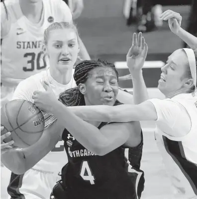 ?? ERIC GAY/AP ?? South Carolina’s Aliyah Boston (4) is swarmed by Stanford’s Cameron Brink, rear, and Lexie Hull on Friday in San Antonio.