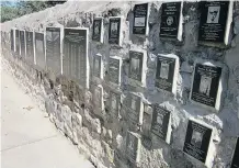  ?? MICHELE JARVIE ?? Plaques listing the names of those who served in Pacific battles are embedded in the walls of the courtyard outside the National Museum of the Pacific War in Fredericks­burg, Texas.