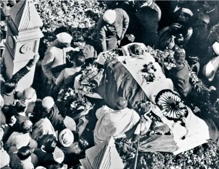  ?? ?? THE FUNERAL PROCESSION of Mohandas K. Gandhi in Delhi.