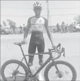  ??  ?? Star cyclist, Jamual John punches the air after soloing to an emphatic victory yesterday. (Emmerson Campbell photo)