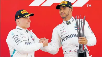  ??  ?? Valtteri Bottas, above left, is proving an ideal teammate for Lewis Hamilton. Left, Hamilton leads Bottas at the Spanish Grand Prix.