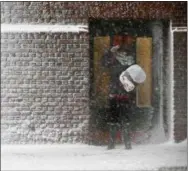  ?? MICHAEL DWYER — THE ASSOCIATED PRESS ?? A person stands in the winddriven snow during a winter storm Tuesday in Boston. The storm was easily the largest storm this winter.