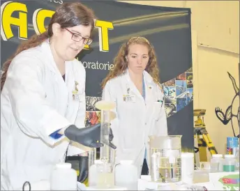  ?? ADAM MACINNIS/THE NEWS ?? Jenna Kennedy and Kathleen Baker from AGAT laboratori­es were one of the businesses that took part in the job fair in Pictou Landing First Nation on Friday.