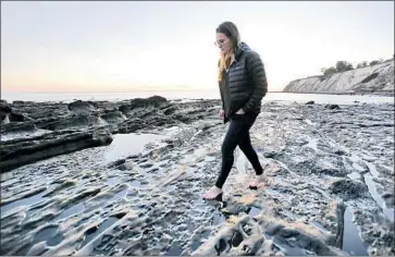  ?? Al Seib Los Angeles Times ?? ELISE BOISE-COSSART of the Hollister Ranch Managed Access Program walks the beach at low tide.