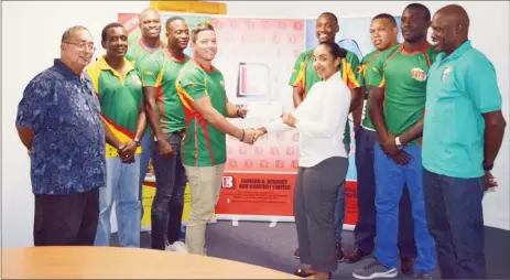  ??  ?? National rugby 7s captain, Ryan Gonsalves collecting the sponsorshi­p cheque from Edward B. Beharry and Companies, Brand Manager, Monique Tiwari in the presence of his charges and GRFU President, Peter Green and Coach, Shane Grant-Stuart.