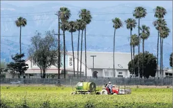  ?? Mel Melcon Los Angeles Times ?? OXNARD PARENTS are concerned that chemicals used on nearby strawberry fields may be harming Rio Mesa High School students. Agricultur­e industry officials say existing rules keep communitie­s safe.