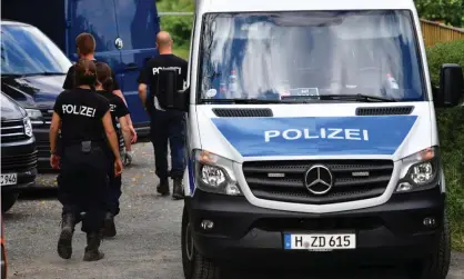  ??  ?? Police officers continue their search of the allotment in in Hanover, Germany. Photograph: Alexander Koerner/Getty Images