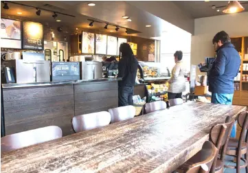  ??  ?? Customers line up inside a Starbucks Coffee shop in Washington following the company’s announceme­nt that they will close more than 8,000 US stores on May 29 to conduct “racial-bias education”. — AFP photo