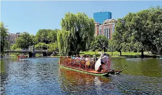  ?? 123RF ?? Tourists enjoy sightseein­g from the famous Swan boats in Boston Public Garden.