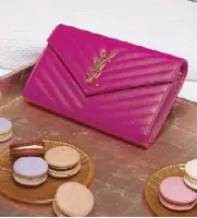  ??  ?? Monogramme chain wallet from Saint Laurent Tray from West Elm Macarons and plates from TWG Tea