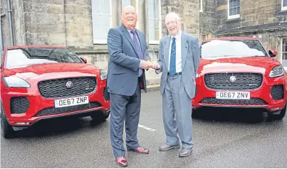  ??  ?? Above and below: Ian Scott Watson receives the Jim Clark Memorial Award from Associatio­n of Scottish Motoring Writers president John Murdoch.