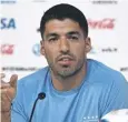  ?? ?? ↑ Uruguay’s Luis Suarez addresses the media