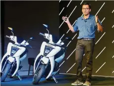  ??  ?? Capturing two-wheeler market: Tarun Mehta gestures while addressing the media during the launch event of electric scooter Ather 450 in Bangalore. — AFP