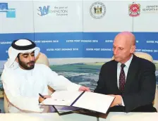  ?? Atiq Ur Rehman/Gulf News ?? Shaikh Khalid Bin Abdullah Bin Sultan Al Qasimi, Chairman of the Sharjah Department of Seaports and Customs, and Jeffrey Bullock, Secretary of State of Delaware sign the port agreement at Sharjah Chamber of Commerce yesterday.