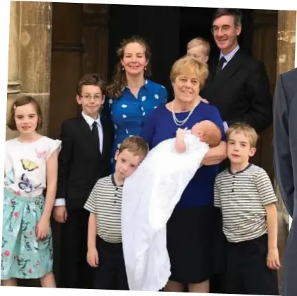  ??  ?? Family man: Mr Rees-Mogg with his family and nanny at the christenin­g of his son Sixtus