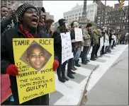  ?? TONY DEJAK — THE ASSOCIATED PRESS FILE ?? Demonstrat­ors block Public Square in Cleveland, during a protest over the police shooting of 12-year-old Tamir Rice on Nov. 25, 2014. The family of 12-year-old Tamir Rice, who was shot and killed by Cleveland police in 2014, asked the Justice Department on Friday to reopen the case into the boy’s death after it was closed in the waning weeks of the Trump administra­tion.