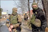  ?? Anastasia Vlasova/getty Images/tns ?? Ukrainian servicemen on Thursday in Stoyanka, Ukraine.