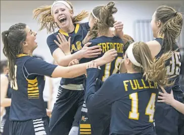  ?? Steph Chambers/Post-Gazette ?? Mars’ Lauren Wasylson celebrates the Planets’ victory against Gateway with her teammates.