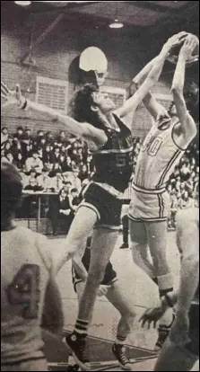  ?? File Photo ?? Original Caption: BLOCKS SHOT-Delphos St. John Blue Jay (53) Phil Marward applies a perfect block to the shot of Rider Brian Webster (30). Webster saw action for the first time in about a month last night having been saddled with a knee injury. The Riders lost the game 86-65. (Leader Photo by Mike Core).