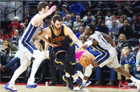  ??  ?? Cleveland Cavaliers forward Kevin Love (0) dribbles the ball as Detroit Pistons forward Jon Leuer (30) and guard Reggie Jackson (1) defend at The Palace of Auburn Hills. Tim Fuller, USA TODAY Sports/Reuters