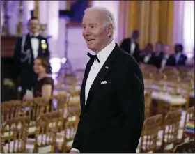  ?? (AP/Manuel Balce Ceneta) ?? President Joe Biden arrives in the East Room of the White House following a dinner reception for the governors and their spouses Saturday in Washington. More photos at arkansason­line.com/213bidengo­vs/.