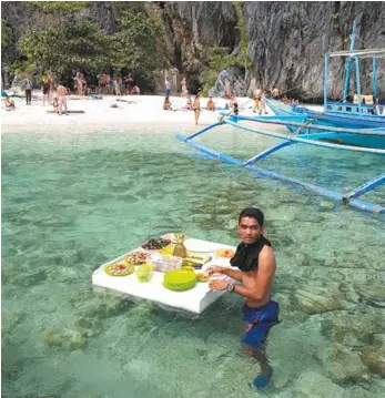  ??  ?? Among the palms ... El Nido Resort (left); a floating lunch (above); boats at El Nido (below).