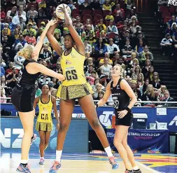  ?? FILE ?? Jamaica’s goal shooter Romelda Aiken (centre) catches the ball ahead New Zealand’s goalkeeper, Casey Kpua, as goal defence Katrina Grant (right) looks on, during the Netball World Cup Pool E match at the Allphones Arena, Sydney Olympic Park, Australia,...