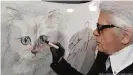  ?? ?? Karl puts the finishing touches to an image of his beloved Burmese cat, Choupette