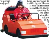  ??  ?? TOP GEAR: Claudia driving a Lego car around Toytown. Far right: Fans watch the Lego Movie 4D