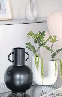  ?? ?? Handle Ceramic Vase, £28; Artificial Foliage in White Vase, £38, Next
Pottery is right on point, and artisan pieces such as these distinctiv­e vessels will contrast beautifull­y with a monochrome scheme.