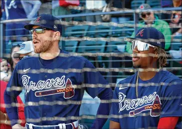  ?? PHOTOS BY CURTIS COMPTON / CCOMPTON@AJC.COM ?? Freddie Freeman (left) could be an MVP candidate if he approximat­es his 60-game numbers from last season (when he hit .310/.394/.578 with 15 homers, 15 doubles and 37 RBIs in 59 games). Ronald Acuna (right) also was solid through 60 games (.281/.367/.465 with 11 homers and 34 RBIs in 228 at-bats).