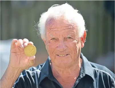  ?? Picture: George McLuskie. ?? Ex-Scottish record holder James Robb with one of his athletics medals.