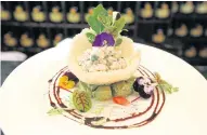  ??  ?? Lobster timbale with avocado, coriander and chives in crispy Parmesan cups drizzled with tea-infused vinaigrett­e.