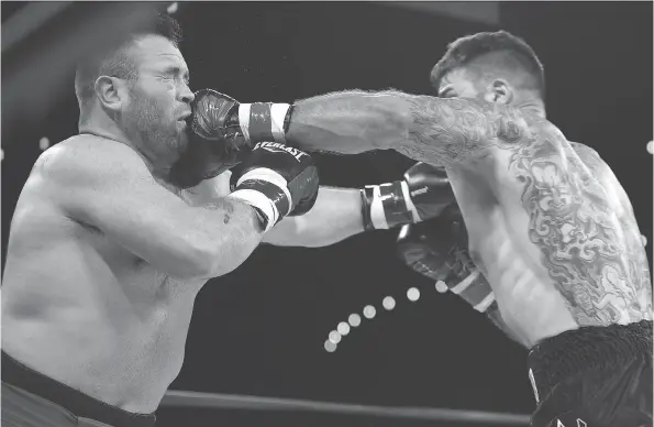  ?? ED KAISER ?? Adam Braidwood connects with Tim Hague’s jaw during the KO 79 boxing event at the Shaw Centre in Edmonton on June 16. Hague collapsed in the ring and died shortly after.