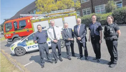  ??  ?? Station Manager Rob Dellow, Deputy Chief Constable Craig Denholm, Chairman of the Hampshire Fire Authority Royston Smith, PCC Simon Hayes, Chief Officer John Bonney and PC Jessica Wilkins outside the fire service’s Eastleigh HQ which will be shared by Hampshire Constabula­ry.