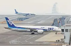  ??  ?? WORRIES AND WOES: This file picture an ANA Boeing 787 Dreamliner (bottom) being pulled by a towing tractor at Tokyo’s Haneda airport after a ANA Dreamliner passenger plane made an emergency landing in western Japan when smoke was reportedly seen inside...