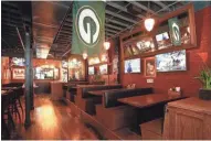  ?? ADAM LARKEY PHOTOGRAPH­Y ?? Wally's Wisconsin Tavern in Denver features Wisconsin-themed food and sports teams.