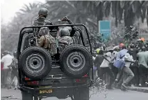  ?? PHOTO: REUTERS ?? Riot police attempt to disperse supporters of Kenya’s opposition National Super Alliance coalition during a protest in Nairobi.