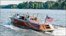  ?? ?? Take a ride in a wooden Hacker-Craft boat with Oconee Classic Boats.