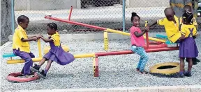  ?? PHOTOS BY CHRISTOPHE­R SERJU ?? Children at play at New Life Basic School.