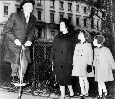  ??  ?? silly, VAiN MAN: Enoch Powell, then Minister for Health, demonstrat­es the correct technique for using a pogo stick to wife Pam and daughters Susan and Jennifer in 1962, the year after his ‘Water Tower’ speech