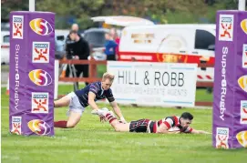  ?? ?? Try scorer Caleb Kortweg dives under the posts